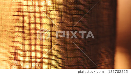 shot of linen transparent curtains with sunset light 125782225