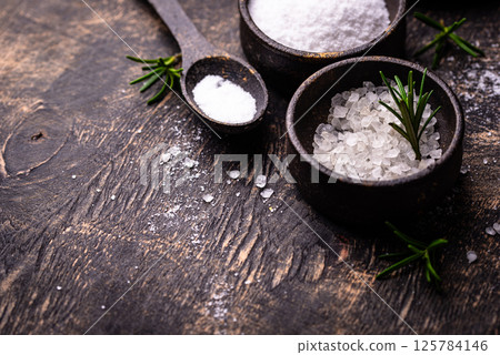 Natural sea salt crystals on dark background 125784146