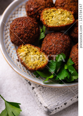 Middle Eastern falafel balls with sauce 125784147