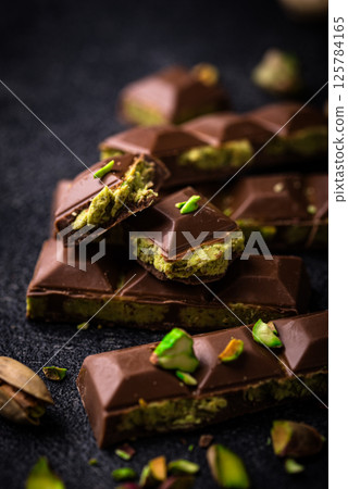 Dubai chocolate with kadayif pistachio filling 125784165
