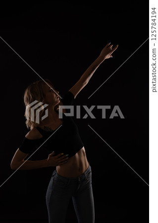 blonde woman dancing alone to music blonde woman dancing alone to music 125784194