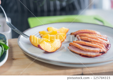 The chef serves roast duck.  125784315