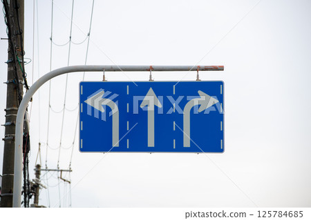 Road sign with three lanes and different traffic directions Road sign with three lanes and different traffic directions 125784685