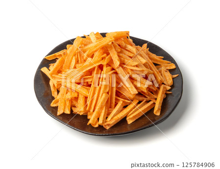 Fried chips sticks isolated, finger potato chips, golden shoestring fries pile, French fries 125784906
