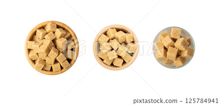 Raw Brown Cane Sugar Isolated on White Background Raw Brown Cane Sugar Isolated on White Background 125784941