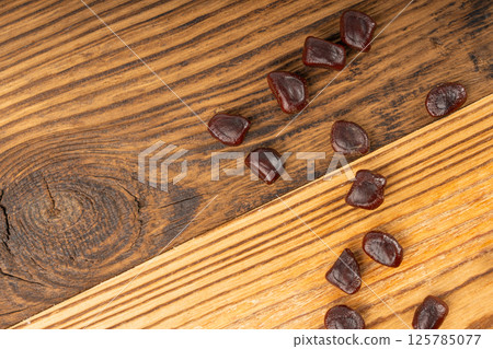 Dried tamarind seeds isolated, Tamarindus indica beans on a white background, medicine ingredient 125785077