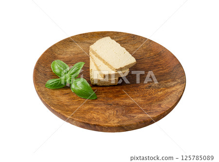 Tofu Cheese Isolated, Smoked Vegan Cheese Slice, Sliced Soya Bean Curd, Soy Protein or TSP Tofu Cheese Isolated, Smoked Vegan Cheese Slice, Sliced Soya Bean Curd, Soy Protein or TSP 125785089