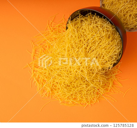 Raw vermicelli, gold soup pasta, small homemade noodles, thin Italy macaroni Raw vermicelli, gold soup pasta, small homemade noodles, thin Italy macaroni 125785128