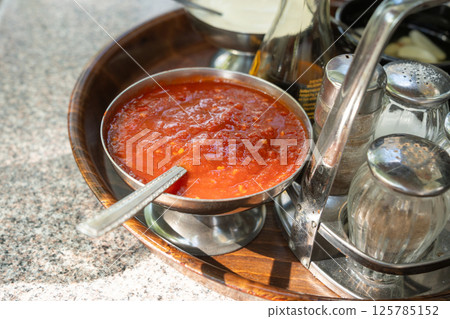 Vietnamese sauces set on the table in a street restaurant closeup. Mayonnaise, garlic dressing Vietnamese sauces set on the table in a street restaurant closeup. Mayonnaise, garlic dressing 125785152