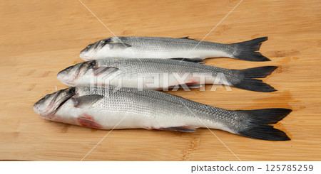 European seabass or Dicentrarchus labrax, whole raw labrax, branzino fish, European bass 125785259