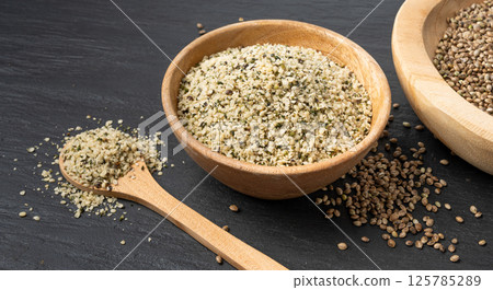 Shelled hemp seeds pile, peeled cannabis grains, marijuana kernels without peel 125785289