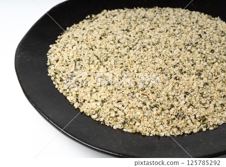 Shelled hemp seeds pile, peeled cannabis grains, marijuana kernels without peel 125785292