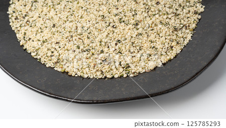 Shelled hemp seeds pile, peeled cannabis grains, marijuana kernels without peel 125785293