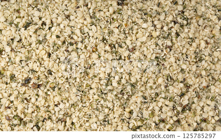 Shelled hemp seeds pile, peeled cannabis grains, marijuana kernels without peel 125785297