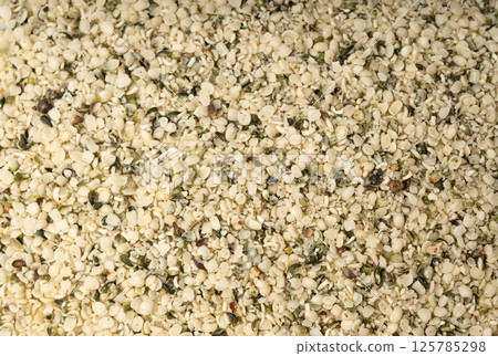 Shelled hemp seeds pile, peeled cannabis grains, marijuana kernels without peel Shelled hemp seeds pile, peeled cannabis grains, marijuana kernels without peel 125785298