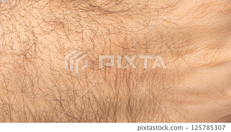 Macro texture of hairy human skin, close view of male arm, body hair, natural surface pattern Macro texture of hairy human skin, close view of male arm, body hair, natural surface pattern 125785307