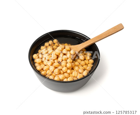Soaked chickpeas, chick pea in water, swollen wet Cicer arietinum fruits, garbanzo beans cooking 125785317