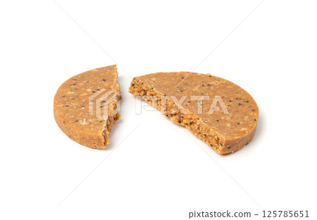 Protein cookie isolated, broken round energy snack with peanuts, chicory fibre Protein cookie isolated, broken round energy snack with peanuts, chicory fibre 125785651