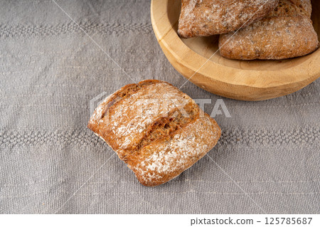 Brown rye bun, square gluten free bread, whole grain healthy breakfast bread 125785687