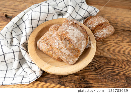 Brown rye bun, square gluten free bread, whole grain healthy breakfast bread 125785689