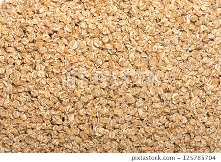 Spelt flakes isolated, dry raw rolled flat oat grains, wheat, oatmeal or bran, barley rye cereals Spelt flakes isolated, dry raw rolled flat oat grains, wheat, oatmeal or bran, barley rye cereals 125785704