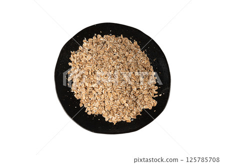Spelt flakes isolated, dry raw rolled flat oat grains, wheat, oatmeal or bran, barley rye cereals Spelt flakes isolated, dry raw rolled flat oat grains, wheat, oatmeal or bran, barley rye cereals 125785708
