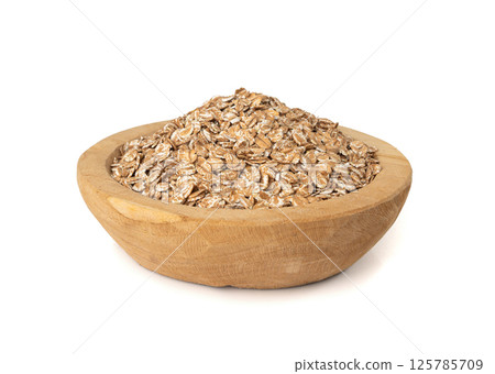 Spelt flakes isolated, dry raw rolled flat oat grains, wheat, oatmeal or bran, barley rye cereals 125785709