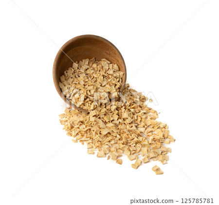 Dry parsley root, dried diced celery cubes, scattered small liquorice pileces, dry vegetable 125785781