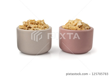 Dry parsley root, dried diced celery cubes, scattered small liquorice pileces, dry vegetable Dry parsley root, dried diced celery cubes, scattered small liquorice pileces, dry vegetable 125785783