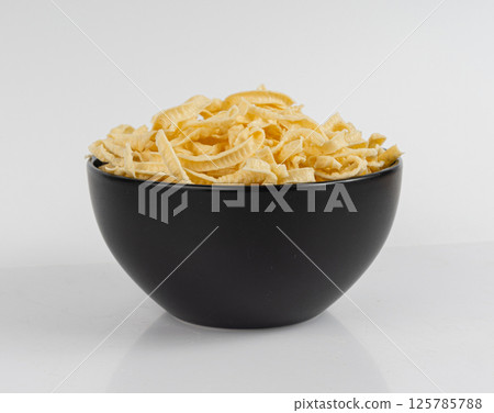 Passatelli spatzle pasta isolated, raw spaetzle noodles, dry homemade german macaroni Passatelli spatzle pasta isolated, raw spaetzle noodles, dry homemade german macaroni 125785788