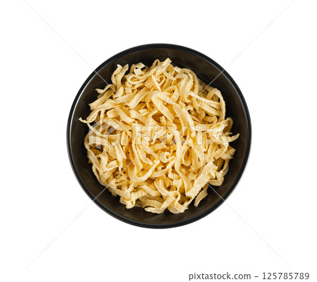 Passatelli spatzle pasta isolated, raw spaetzle noodles, dry homemade german macaroni Passatelli spatzle pasta isolated, raw spaetzle noodles, dry homemade german macaroni 125785789