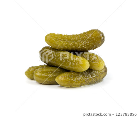 Gherkins isolated, pickled small cucumbers, tiny fermented food, little marinated canned vegetables Gherkins isolated, pickled small cucumbers, tiny fermented food, little marinated canned vegetables 125785856