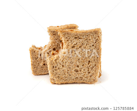 Bitten dried pate sandwich isolated, low-quality food leftovers, bad quality toast bread lunch Bitten dried pate sandwich isolated, low-quality food leftovers, bad quality toast bread lunch 125785884