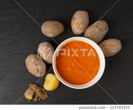 Red mojo rojo and green mojo verde sauces, traditional Tenerife dips, mojo picon dressing 125785935