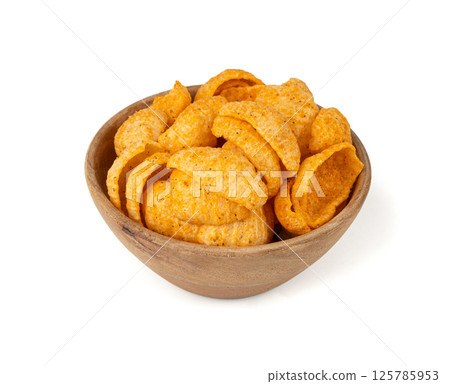 Hummus chickpea chips, chick pea crisps pile, healthy orange snack, fried legume crunchies 125785953