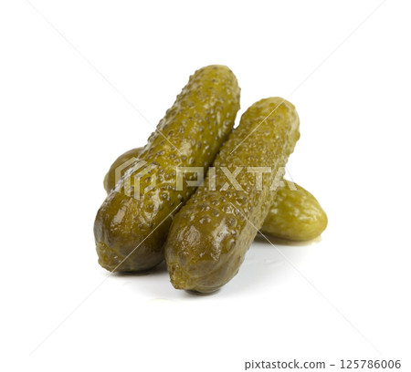 Gherkins isolated, pickled small cucumbers, tiny fermented food, little marinated canned vegetables Gherkins isolated, pickled small cucumbers, tiny fermented food, little marinated canned vegetables 125786006