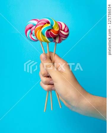 Color lollipop, spiral candy on stick, colorful striped lollypop, round fruit caramel, circle lollipop Color lollipop, spiral candy on stick, colorful striped lollypop, round fruit caramel, circle lollipop 125786034