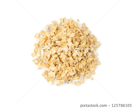 Dry parsley root, dried diced celery cubes, scattered small liquorice pileces, dry vegetable 125786105