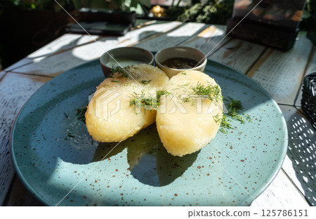 Lithuanian potato dumplings, cepelinai pancakes or kolduny, meat stuffed draniki, traditional didzkukuliai 125786151