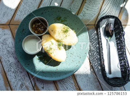 Lithuanian potato dumplings, cepelinai pancakes or kolduny, meat stuffed draniki, traditional didzkukuliai Lithuanian potato dumplings, cepelinai pancakes or kolduny, meat stuffed draniki, traditional didzkukuliai 125786153