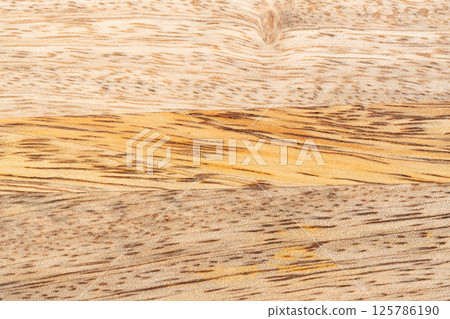 Mango wood texture top view. Kitchen wooden tray background, organic Mangifera indica veneer Mango wood texture top view. Kitchen wooden tray background, organic Mangifera indica veneer 125786190