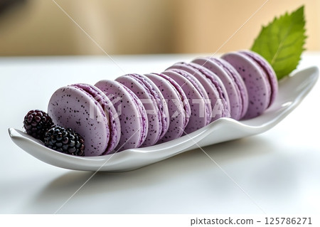 Elegant Purple Macarons with Blackberries on Stylish Plate 125786271