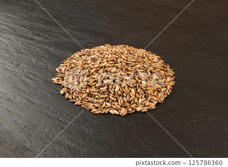Milk thistle seeds, silybum marianum grains, dry blessed milkthistle fruits, variegated thistle kernels Milk thistle seeds, silybum marianum grains, dry blessed milkthistle fruits, variegated thistle kernels 125786360