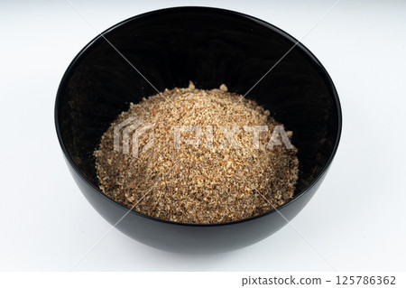 Milk thistle seeds powder, crushed silybum marianum grains pile, milled dry blessed milkthistle Milk thistle seeds powder, crushed silybum marianum grains pile, milled dry blessed milkthistle 125786362
