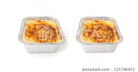 Lasagna portion in aluminium foil tray isolated. Oven baked lasagne for heating, container, airplane food Lasagna portion in aluminium foil tray isolated. Oven baked lasagne for heating, container, airplane food 125786953