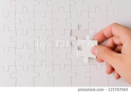 Jigsaw puzzle final piece 125787069