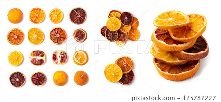 Set of dried slices of orange and blood orange isolated on white background. Dry lemon Set of dried slices of orange and blood orange isolated on white background. Dry lemon 125787227