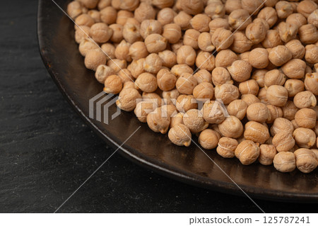 Chickpea, chick pea pile, dry Cicer arietinum fruits, raw Bengal gram legume, garbanzo beans Chickpea, chick pea pile, dry Cicer arietinum fruits, raw Bengal gram legume, garbanzo beans 125787241