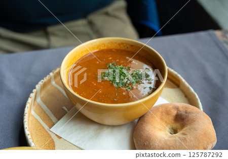 Spicy kharcho or harcho soup, traditional Georgian chowder. Creamy kharcho broth Spicy kharcho or harcho soup, traditional Georgian chowder. Creamy kharcho broth 125787292