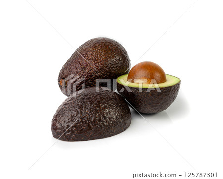 Hass Avocado Half Isolated, Whole Sharwil Set, Brown Avocados Cut, Fresh Alligator Pear, Persea Americana Hass Avocado Half Isolated, Whole Sharwil Set, Brown Avocados Cut, Fresh Alligator Pear, Persea Americana 125787301